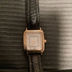 Vintage Ladies Tank style watch. Gold Tone. Runs